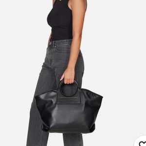 Anthropologie/Urban Originals circle handle tote bag.